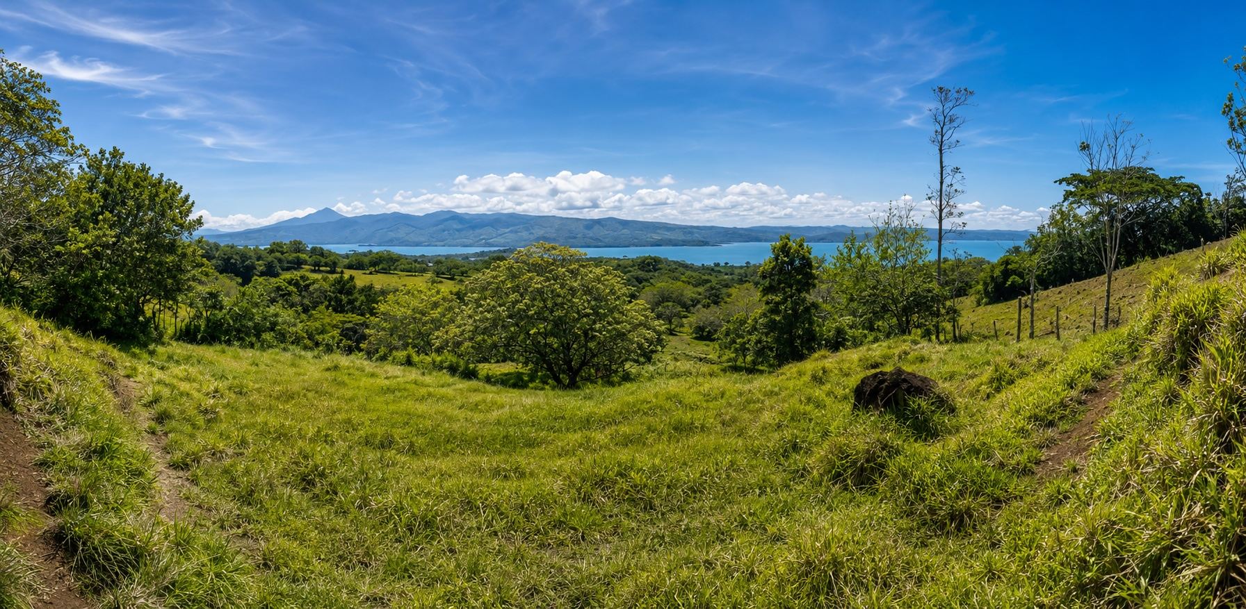 Panorama from the top of the property across Lake Arenal to distant mountains